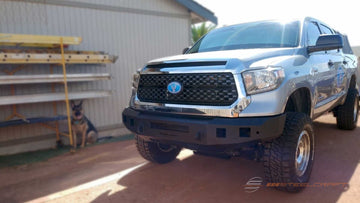 2007-2021 Toyota Tundra equipped with Steelcraft Fortis Front Bumper 71-13380 in textured black finish, customer review from NAPA Online highlighting tight body fitment, aggressive off-road styling, steel construction, and superior front-end protection.